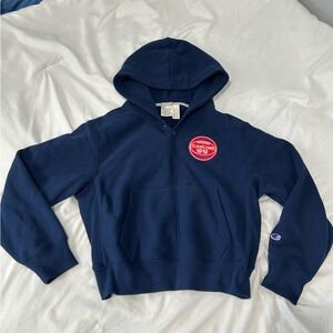 Champion Dark Blue Hoodie with Red Emblem